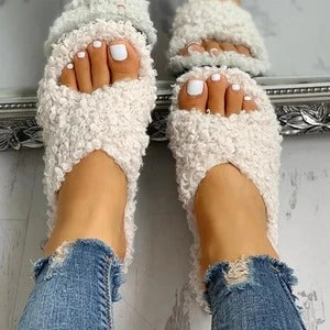 Cross hairy slippers to keep warm at home
