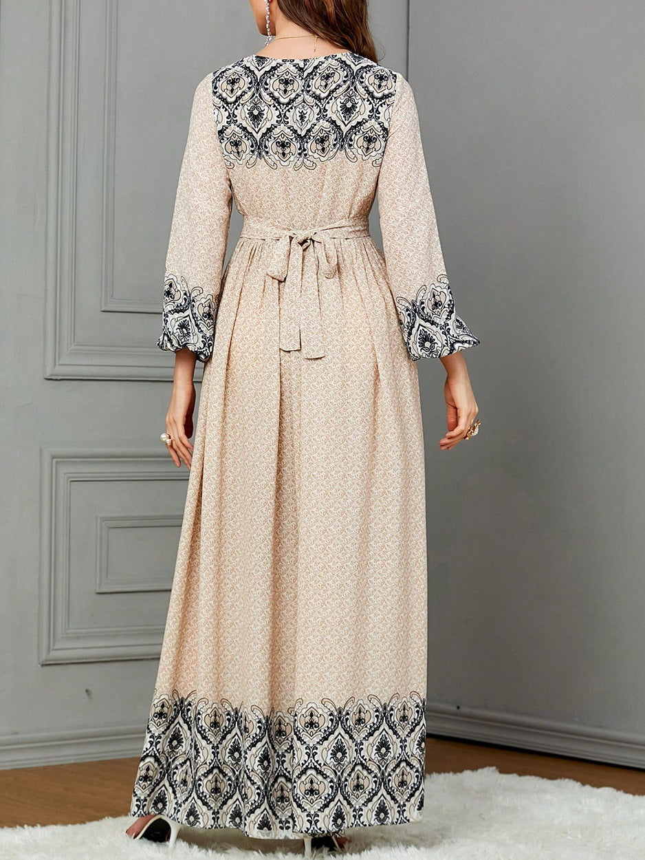 Ethnic-style Printed Wrap Dress Featuring A Cinched Waist Belt And A Flared, Long Skirt