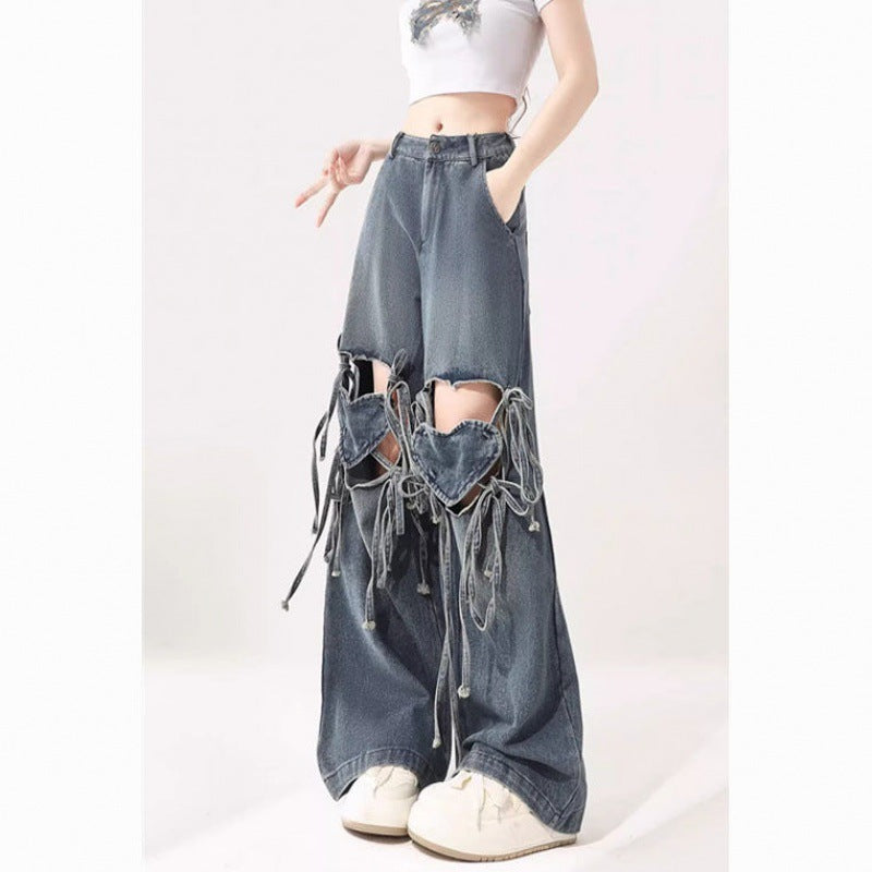 Damehøjtaljede jeans med kærlighedsremdesign