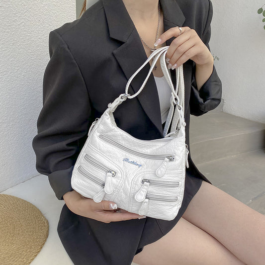 Vasket lammeskind skuldertaske/crossbody taske til kvinder med flere lommer