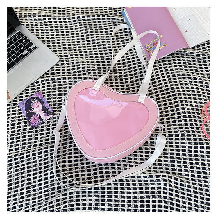 Enkel alt-matchende hjerteformet gennemsigtig hånd-crossbody-taske