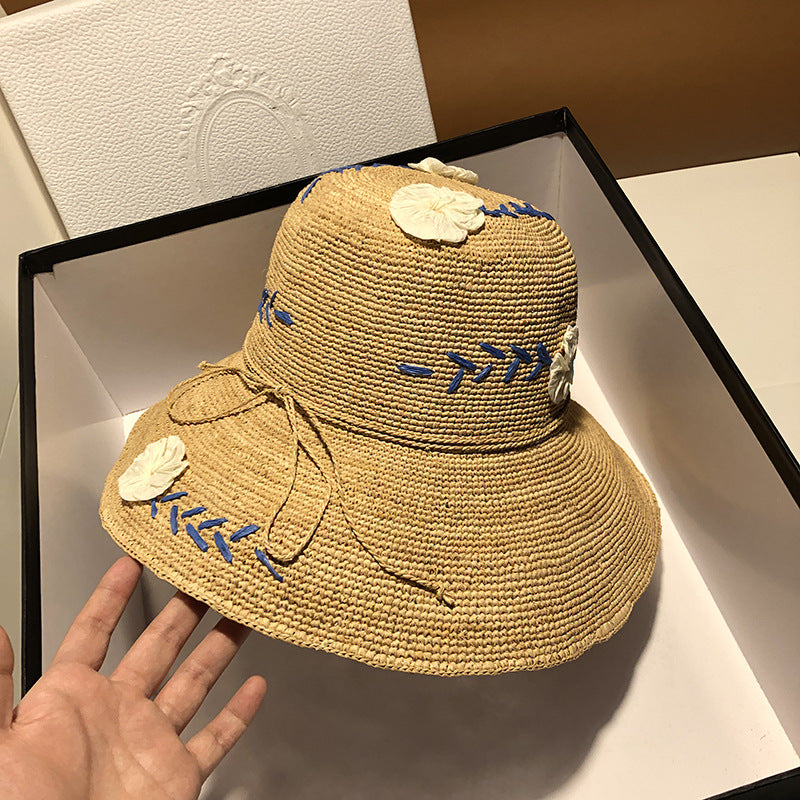 Women's Raffia Hat With Embroidered Flowers On Vacation By The Sea