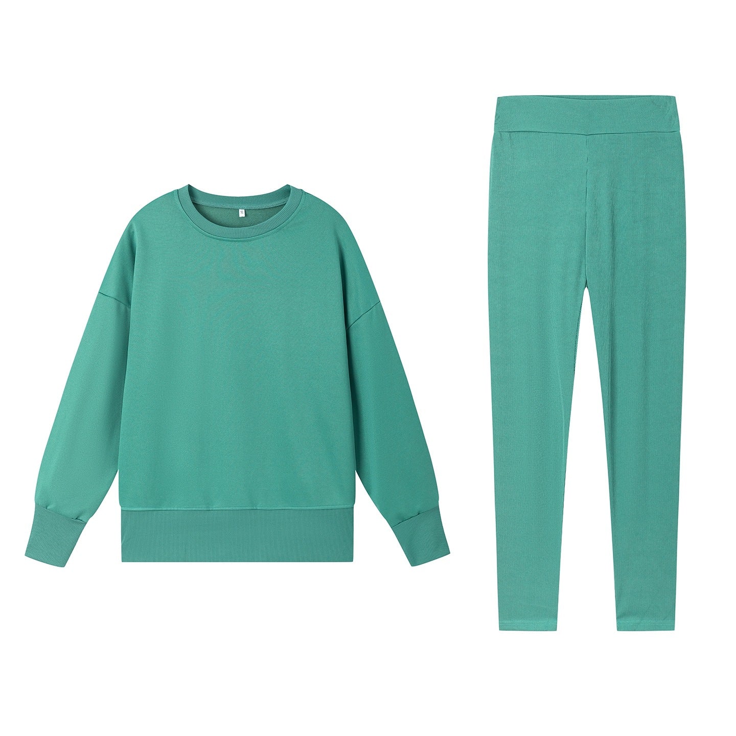Casual Relaxed Fit Long Sleeve Crew Neck Top With Side Slits Paired With Matching Sweatpants