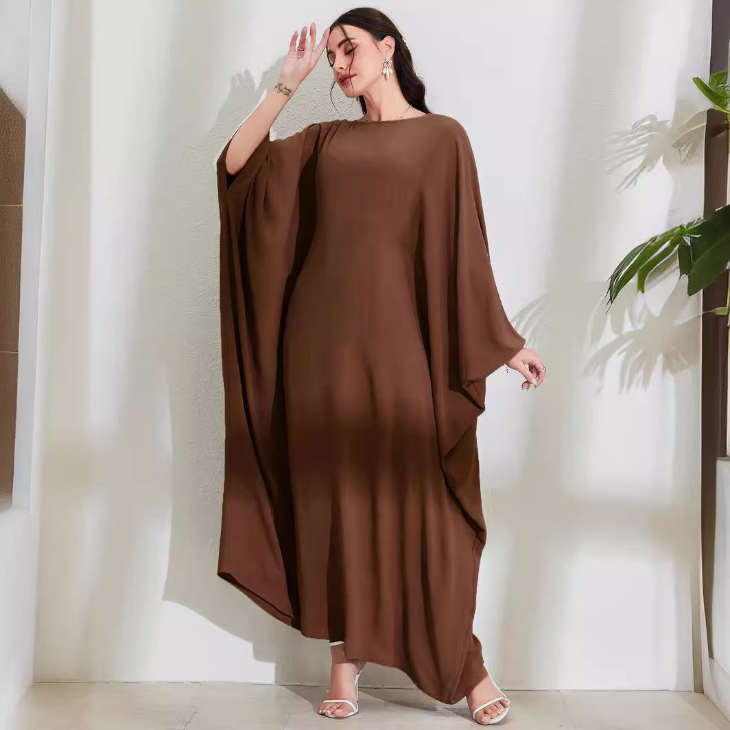 Long Dress With Tie Details Batwing Sleeves And A Round Necklinestylish And Elegant