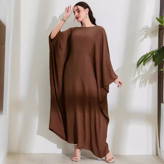 Long Dress With Tie Details Batwing Sleeves And A Round Necklinestylish And Elegant