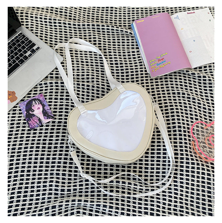 Enkel alt-matchende hjerteformet gennemsigtig hånd-crossbody-taske