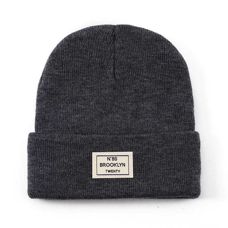 Knitted Beanie With Brand Label Stylish And Fashionable