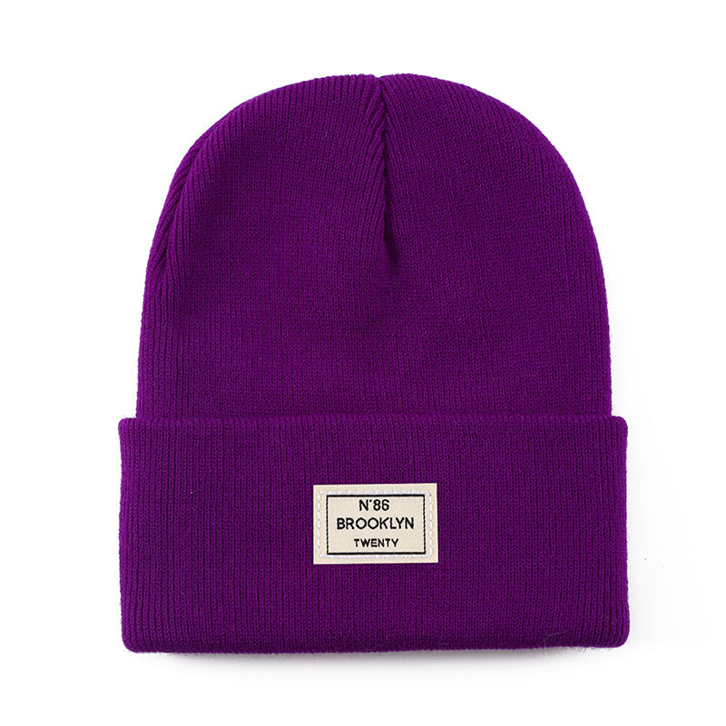 Knitted Beanie With Brand Label Stylish And Fashionable