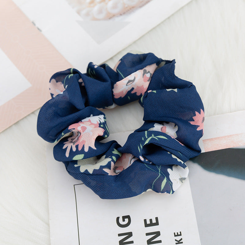 Hårsløjfe til tyktarmen med blomstret stofprint