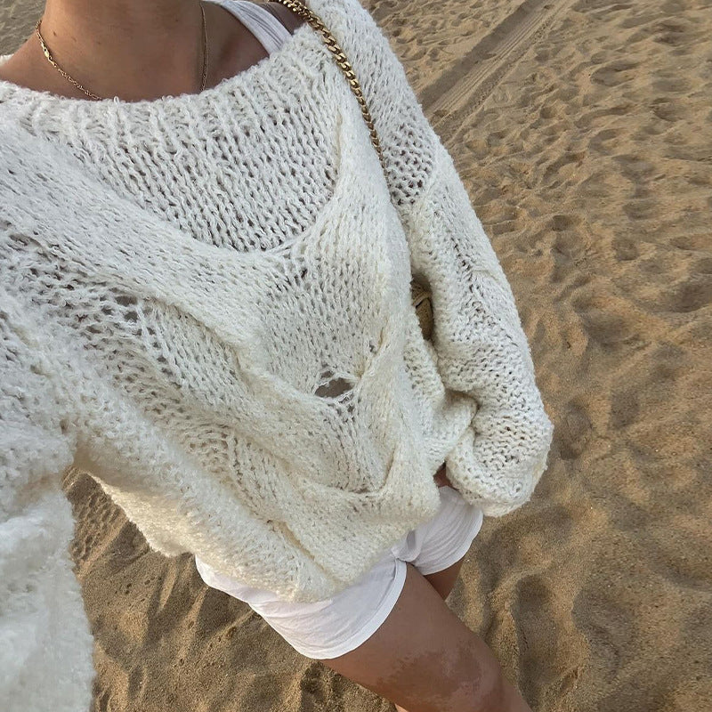 Ensfarvet rundhalset kabelstrikket sweater