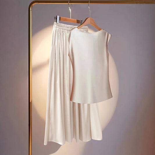 Sleeveless Scooped-neck Top Paired With A Pleated Skirt