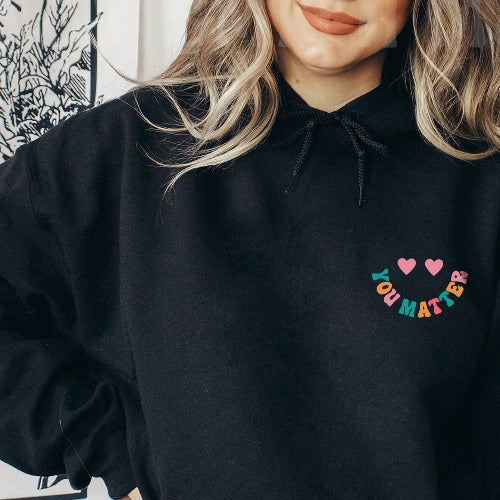 Oversized hoodie til kvinder med tekst bagpå til vinter