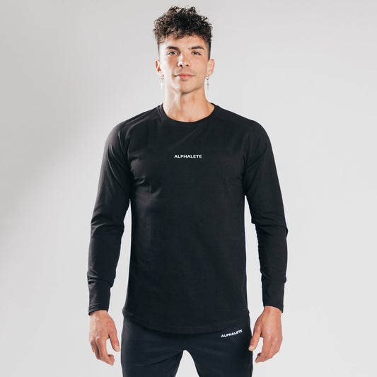 Tætsiddende langærmet T-shirt i elastisk bomuld til at have indenunder