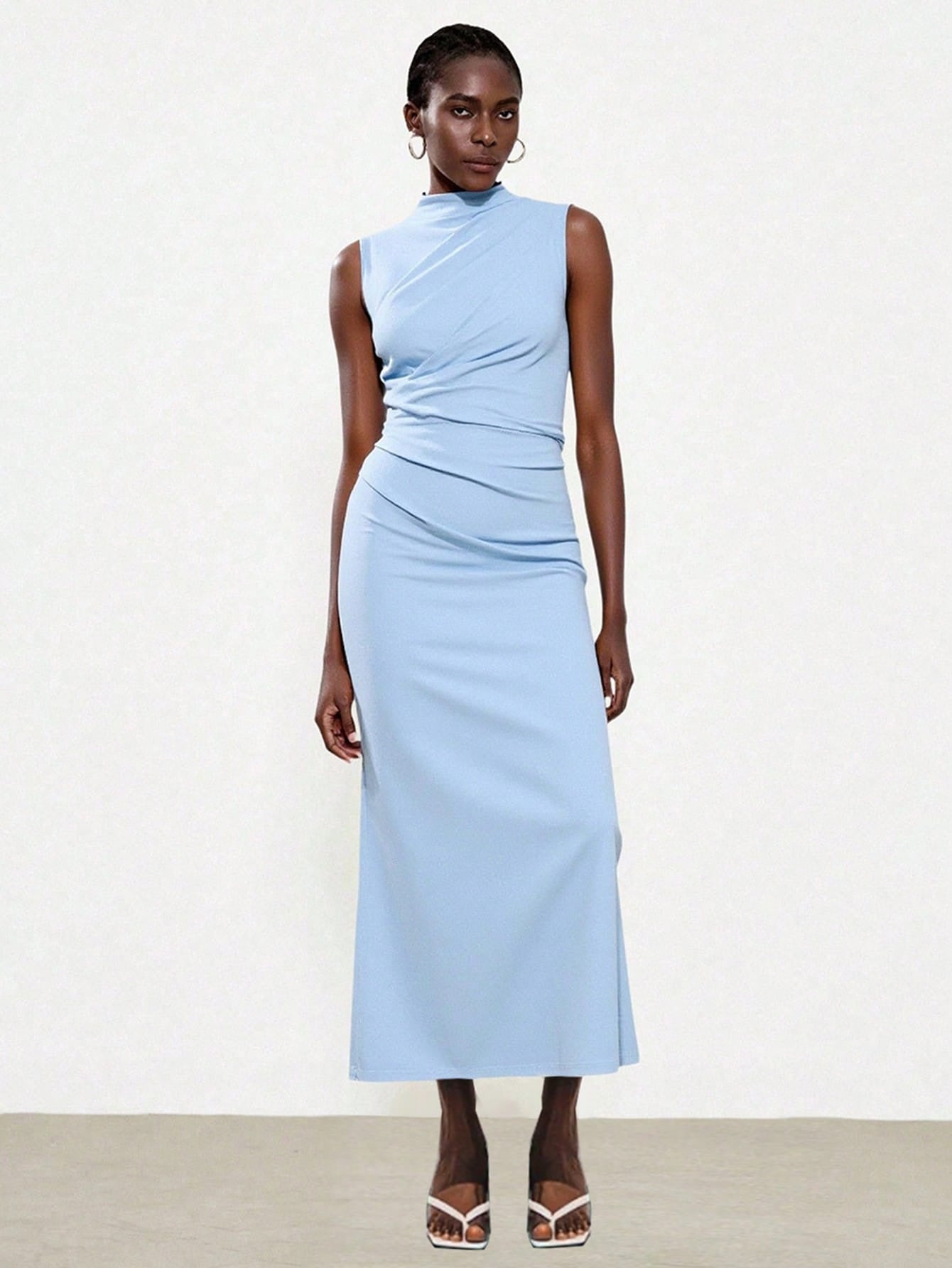 Elegant Sleeveless Slit Dress With A Sophisticated Vibe