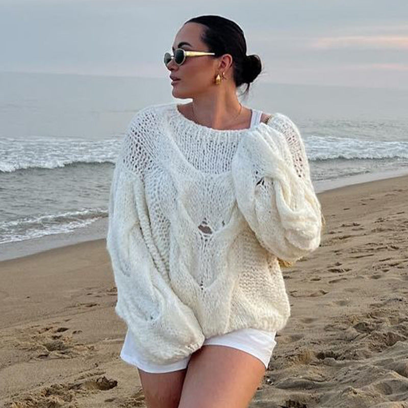 Ensfarvet rundhalset kabelstrikket sweater
