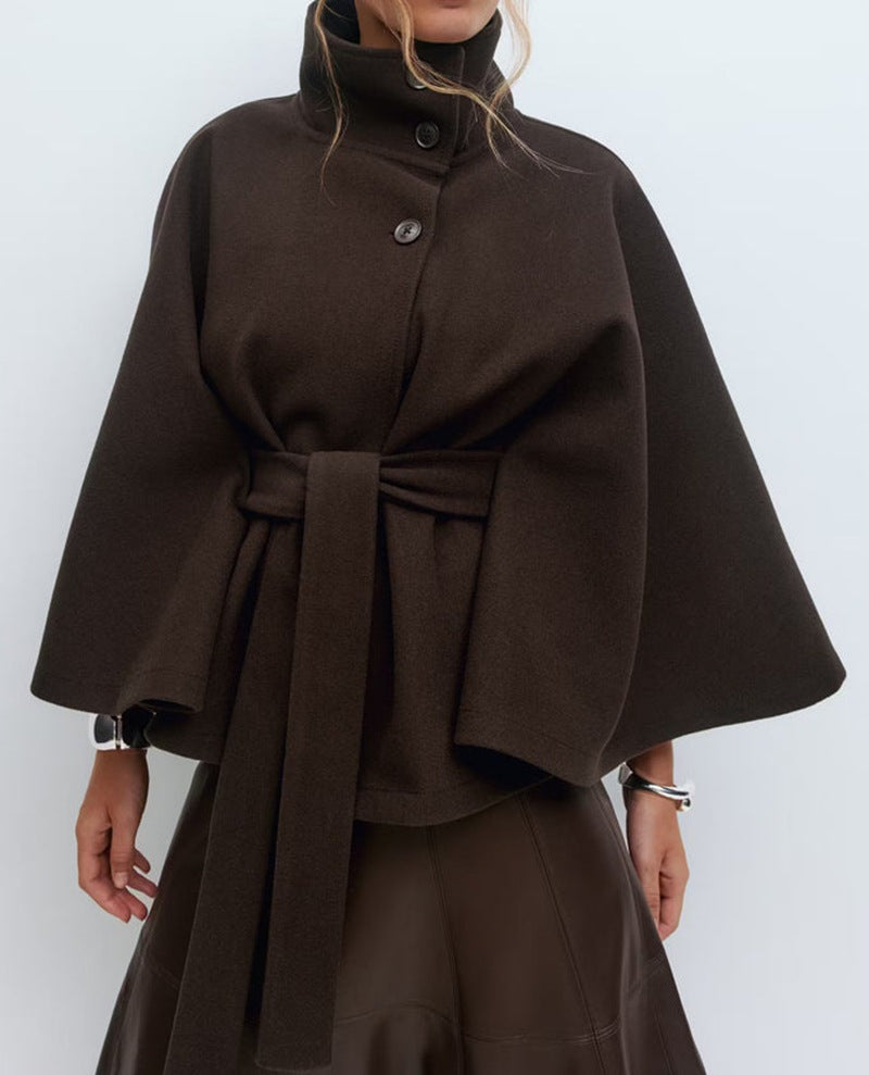 Trench Coat With A Stand-up Collar Buttons And A Belt