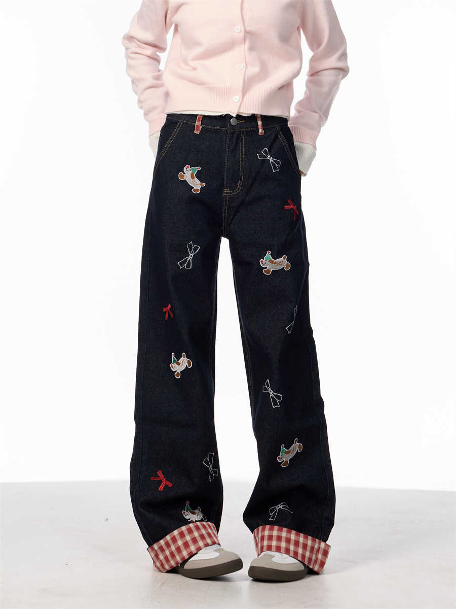 Vintage jeans med broderet sløjfe, hvalpemotiv og vide ben samt høj talje