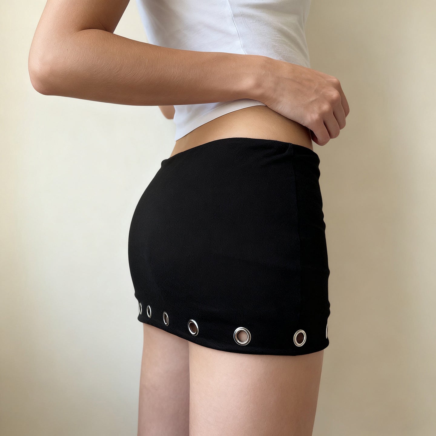 Metal Grommet-punched Low-rise Body-hugging Edgy Casual Style Solid-color Mini Skirt For Bold Chic Looks