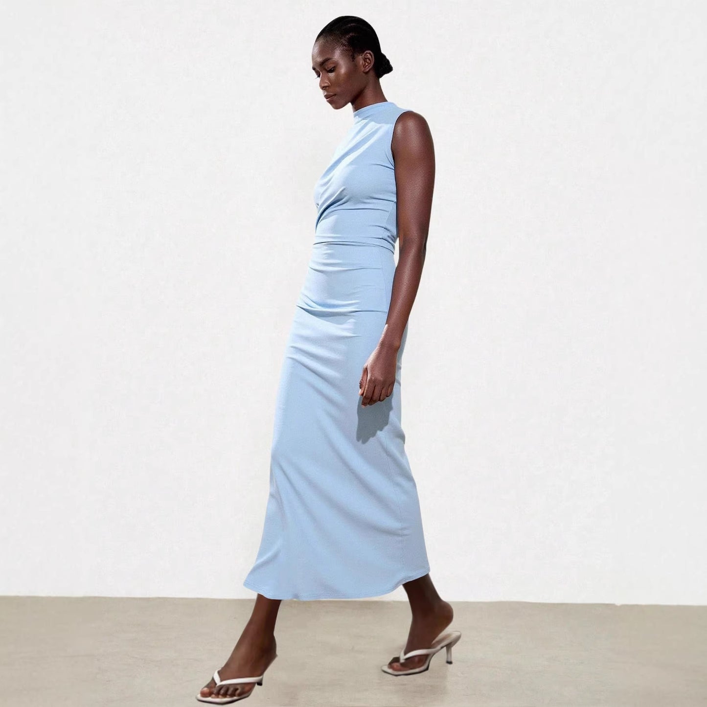 Elegant Sleeveless Slit Dress With A Sophisticated Vibe