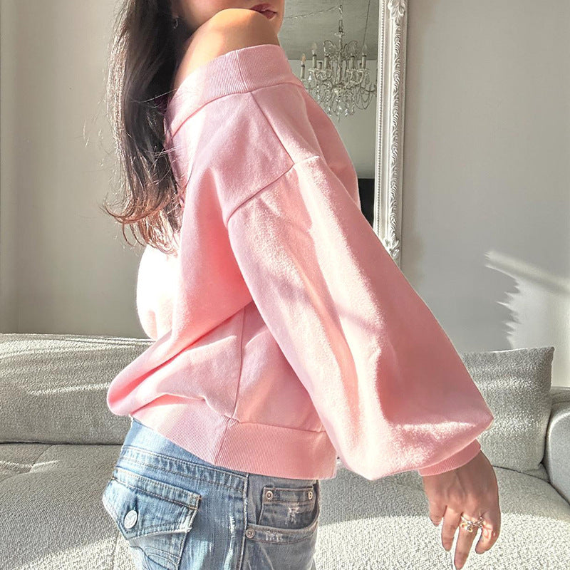 Løs og afslappet off-shoulder top med lange ærmer