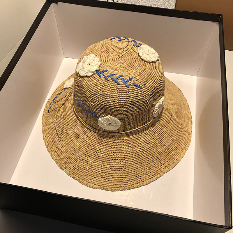 Women's Raffia Hat With Embroidered Flowers On Vacation By The Sea
