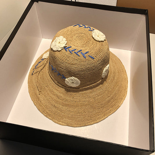 Women's Raffia Hat With Embroidered Flowers On Vacation By The Sea