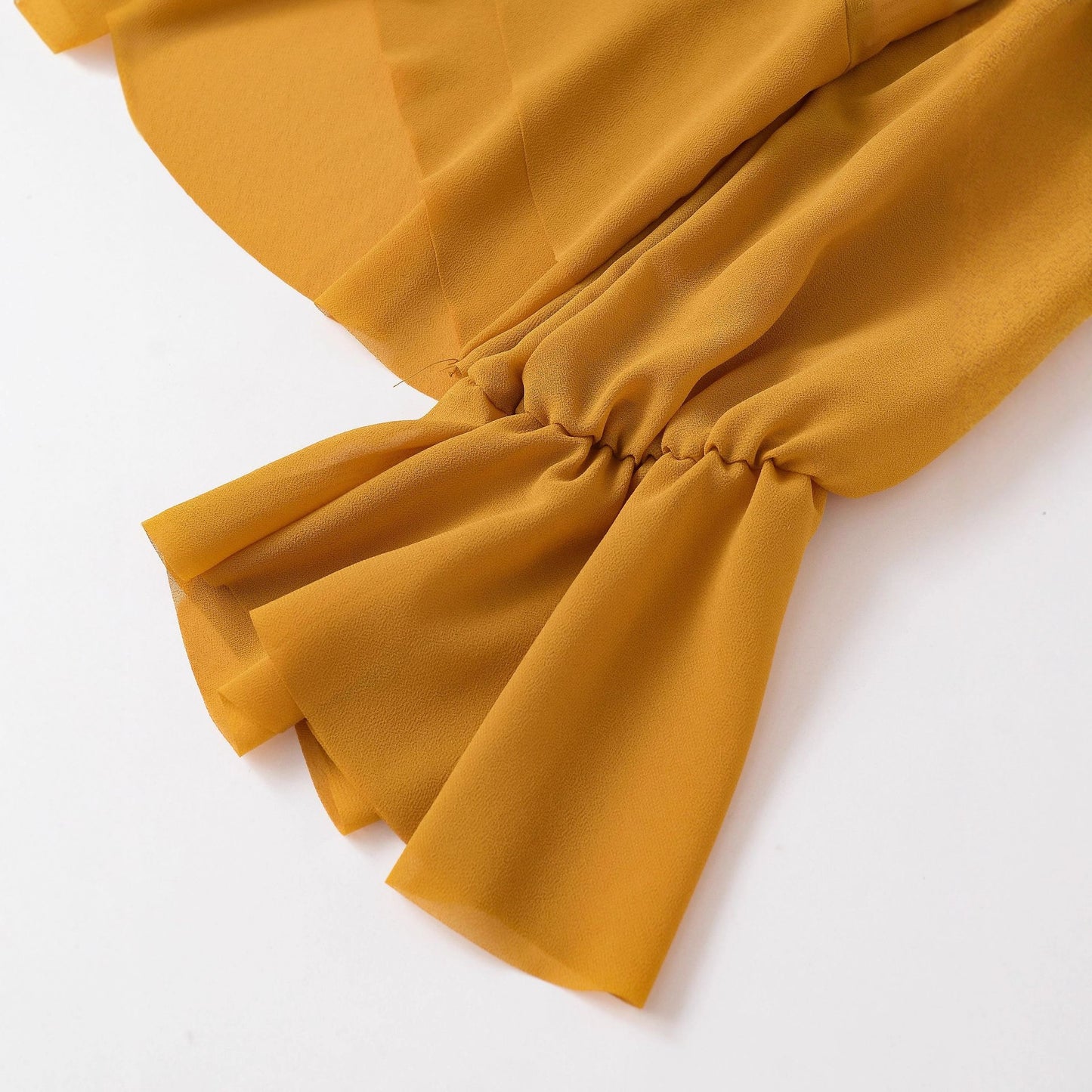 Elegant Chiffon Top With A Flowing Ruffled Hem