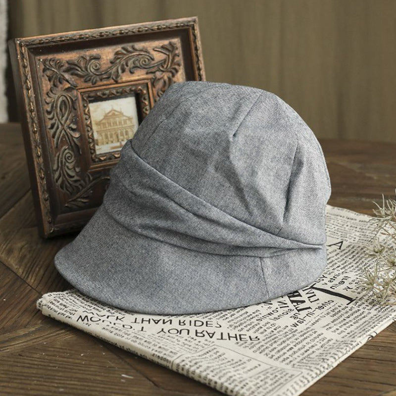 Kunstnerisk afslappet bøllehat med top og krøllet vintage-look