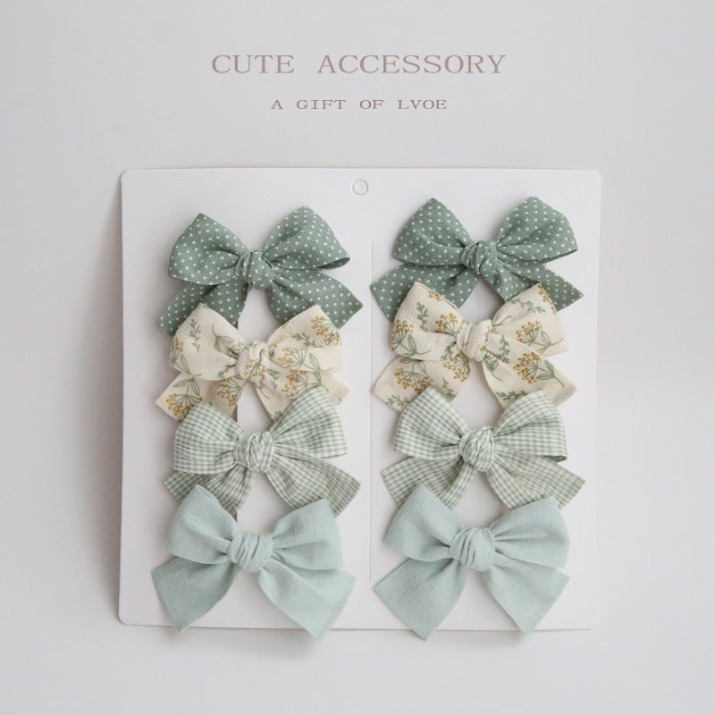 Dovetail Bow Around A Pair Of Hairclips 1 Group