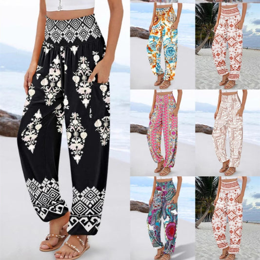 Jumpsuit med smocksyet talje, print og brede ben