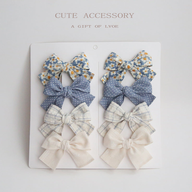 Dovetail Bow Around A Pair Of Hairclips 1 Group