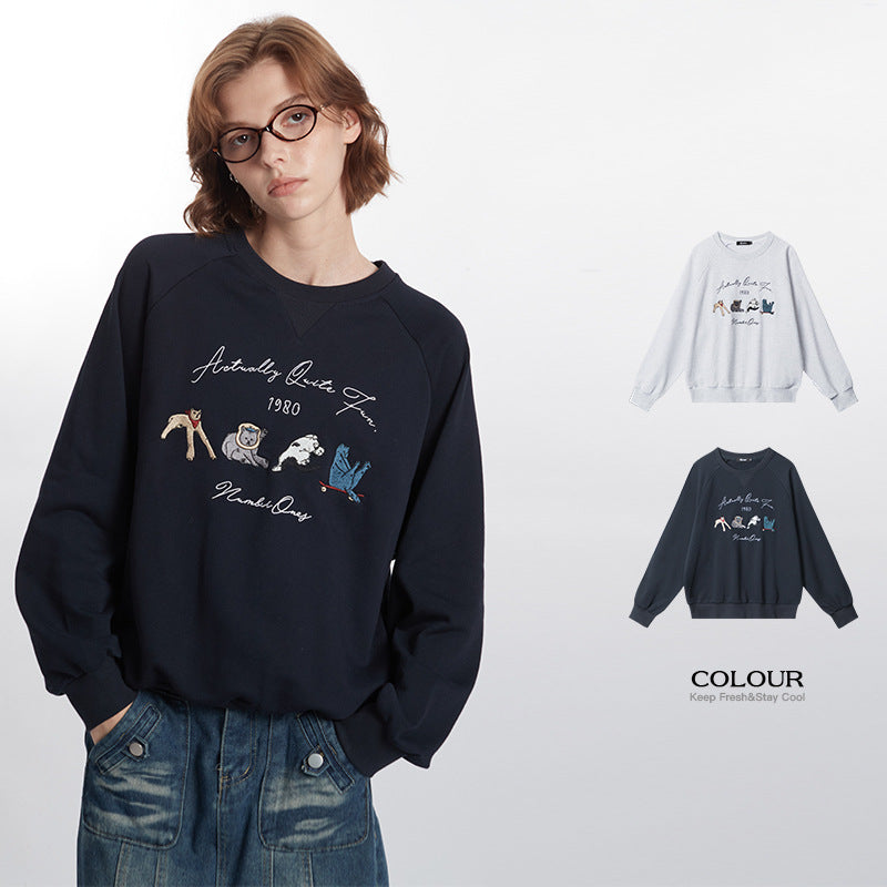 Rundhalset Løs Retrosweater Med Broderet Design Og Lange Ærmer