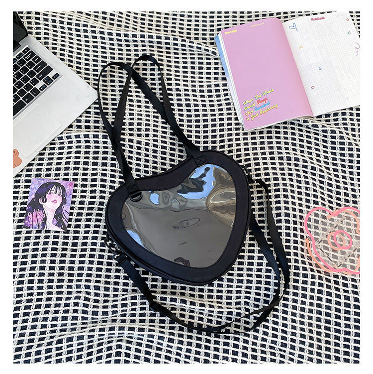 Enkel alt-matchende hjerteformet gennemsigtig hånd-crossbody-taske