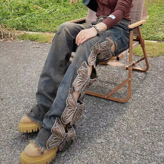 Moderne retro højtaljede jeans til kvinder med broderier, løse huller, vidde ben og udskåret sommerfugledesign